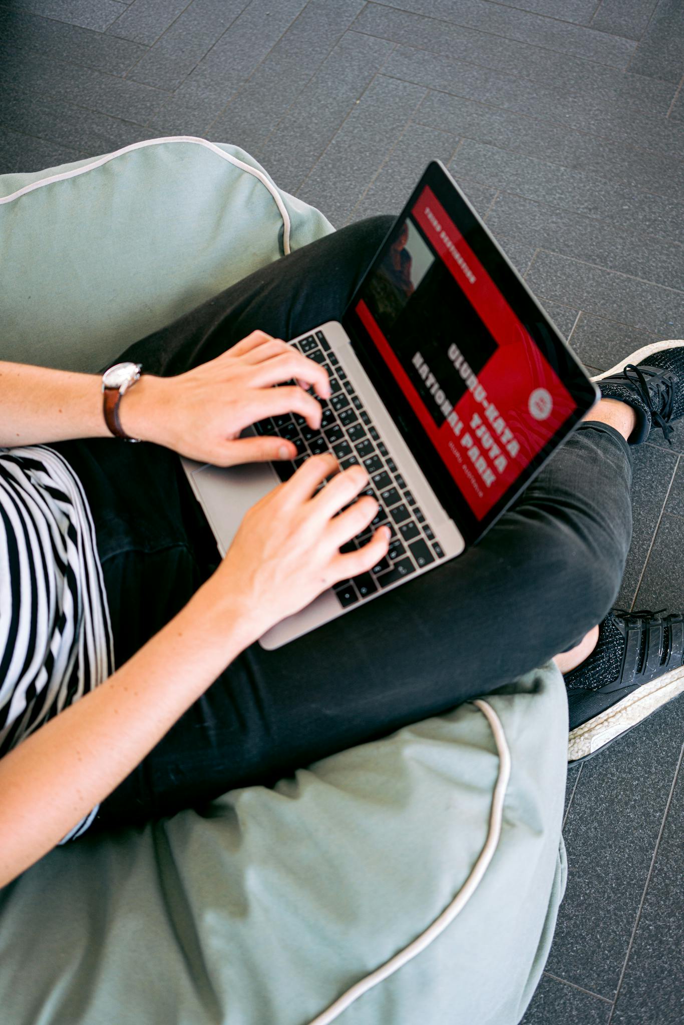 FAQ 1 person working remotely on a laptop while